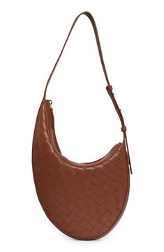 A slightly asymmetric shape adds to the subtle structure of this Italian bag woven in the brand's signature style. Top zip closure Adjustable shoulder strap Leather Made in Italy Designer Handbags Chic Business Shoulder Bag With Intrecciato Weave, Brown Woven Leather Shoulder Bag For Business, Intrecciato Weave Shoulder Bag For Business, Modern Leather Shoulder Bag With Intrecciato Weave, Chic Woven Leather Shoulder Bag For Office, Chic Formal Hobo Bag With Intrecciato Weave, Chic Intrecciato Hobo Bag For Formal Occasions, Modern Brown Woven Leather Shoulder Bag, Modern Brown Woven Leather Hobo Bag