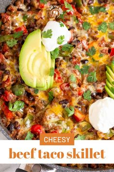 a skillet filled with cheese, black beans and avocado