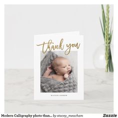 a thank card with a photo of a baby wrapped in a blanket and the words, thank you