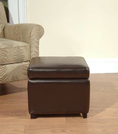 a brown ottoman sitting on top of a hard wood floor