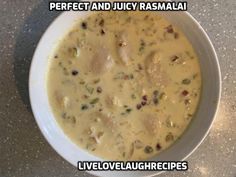 a white bowl filled with food on top of a table