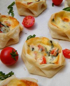 several small pastries with tomatoes and spinach