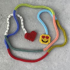 This Long Beaded Rope Necklace is made with Japanese seed beads and FireLine thread.  The necklace  length is 49 inches. The beaded rope length is 47 inches.  Please remove it before showering. Keep away from chemicals, soaps, perfumes and creams.  Let me know if you have any questions. Beaded Rope Necklace, Face Pendant, Long Rope, Beaded Rope, Smiley Faces, Seed Bead Necklace, Rope Necklace, Cool Necklaces, Beaded Necklaces