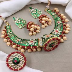 ABOUT JEWELRY- We Present Latest Trendy Fashion Kundan Pearls stud Wedding Wear choker Necklace Jewelry Set. Necklace set Jewelry Decoration with High Quality Kundan Stone, Pearls material. Stunning Party wear, Wedding Neckwear Piece , ethnic wear jewelry for Women. Gold Plated multicolor  Pearl and atone Studded Bridal Wedding Necklace jewelry for Brides and Bridesmaids. Our products are skin-friendly & with love to reach your heart. CONTENT & DIMENSION::- The package includes 1 Necklace,  1 Pair Earrings PACKAGING::- This Jewelry will come nicely wrapped in a bubble wrapped in a white box preventing any kind of Damage. OCCASION::- Gracefully Necklace Jewelry pair with Designer Saree, suit, Wedding Lehenga, Indian Outfit or any Indo-western outfit to enhance your look with Indian Kundan J Rajasthani Jewellery, Hasli Necklace, Jewellery Kundan, Rajputi Jewellery, Party Kleidung, Pakistani Jewelry, Wear Necklaces, Indian Wedding Jewelry, Work Jewelry