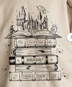 a person wearing a harry potter shirt with hogwarts on it and some books