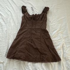 Urban Outfitters Blair Eyelet Mini Dress Size Small Condition: Nwt Color: Brown Details : - Light And Airy Uo Mini Dress In An Allover Eyelet. - Femme Silhouette With Ruffle Trim And A Cutout At The Empire Bust. - Wide Square Neckline - Cutout Tie At The Empire Bust - Smocking At The Back - Ruffle Trim - Body-Skimming Fit - Mini Length Extra: - I Ship Between 1-2 Days Casual Ruffled Mini Dress By Urban Outfitters, Sleeveless Brown Mini Dress With Ruffles, Brown Sleeveless Mini Dress With Ruffles, Urban Outfitters Casual Ruffled Mini Dress, Spring Mini Dress With Square Neck In Brown, Urban Outfitters Casual Mini Dress With Ruffles, Spring Brown Mini Dress With Square Neck, Brown Square Neck Mini Dress For Spring, Brown Mini Dress For Summer