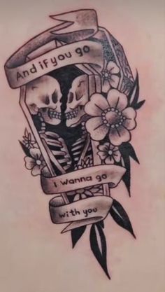 a tattoo with two skulls and flowers on the back of its shoulder, which reads and if you go i wanna to live with you