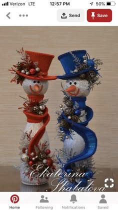 two snowmen are standing next to each other