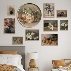 a bedroom with pictures on the wall and a clock