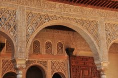 an intricately decorated building with arches and doors