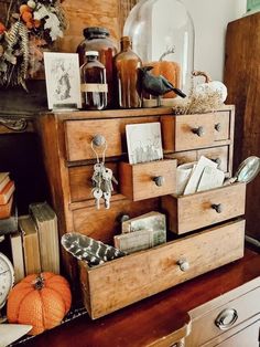 an old dresser with many items on it