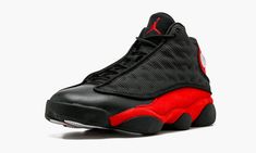 The Air Jordan 13 has been a focal point of retros released in 2017.  It returns in the coveted “Bred” colorway.  This release marks the return of 3M reflective material to the black ballistic nylon upper.  The familiar black tumbled leather returns on the toe.  The suede-wrapped heel and midsole feature the Chicago Bulls-inspired True Red hue.  Red also accents the Jumpman branding on the tongue.  And finally, the signature black cat inspired green holographic jewel occupies its usual place on Black Training Sneakers With Reflective Details, Black Outdoor Sneakers With Padded Tongue, Black Jordan Shoes With Red Sole For Light Sports, Black Dynamic Jordan Shoes For Light Sports, Black Dynamic Jordan Shoes For Sports, Outdoor Black Sneakers With Red Sole, Black Sneakers With Red Sole For Outdoor, Dynamic Black Jordan Shoes For Light Sports, Custom Black Sneakers With Red Sole For Light Sports