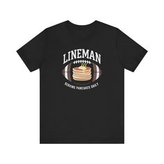 Score a touchdown with style in our Football Lineman T-Shirt! Crafted for the true gridiron enthusiast, this tee celebrates the unsung heroes of the game with its bold design. Featuring the phrase 'LINEMAN' at the top and 'Serving Pancakes Daily' at the bottom, it's a nod to the skill and power of those dominating the line of scrimmage. In the center, a mouth-watering stack of pancakes topped with a dab of butter and steam completes the look. Made with comfort in mind, it's perfect for game days Linebacker Football Shirts, Football Lineman Posters, Linemen Football Mom Shirts, Linemen Football Shirts, Football Lineman Shirts, Lineman Wife Shirts, Lineman Shirts, Football Mom Gifts, Stack Of Pancakes