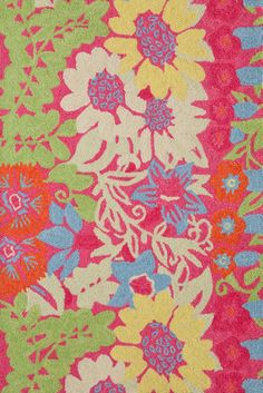 a colorful rug with flowers and leaves on it