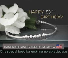 50th birthday bracelet! 5 Beads 5 Decades! A beautiful Sterling Silver bracelet, featuring five larger beads each marking and celebrating an amazing decade. This makes the perfect gift to celebrate a milestone birthday.  It can be worn in years to come as either a part of a bracelet stack or a stand alone piece. Its versatility makes it work for both casual and dressier outfits. Perfect 50th Birthday Gift! This bracelet is adjustable and will fit most adult women's wrists size 6.5 inches to 8 in Anniversary Silver Beaded Bracelets, Anniversary Round Beads Bracelets For Mother's Day, Mother's Day Anniversary Round Beads Bracelets, Anniversary Bracelet With Silver Round Beads, Anniversary Silver Beads Round Bracelets, Silver Bracelets With Round Beads For Birthday, Adjustable Silver Beaded Bracelets For Anniversary, Personalized Beaded Bracelets For Anniversary, Mother's Day Birthday Beaded Bracelets