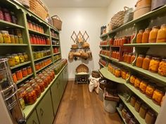 a room filled with lots of different types of jars and containers on the shelves next to each other