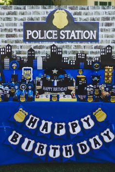 a police station birthday party with blue and yellow decorations