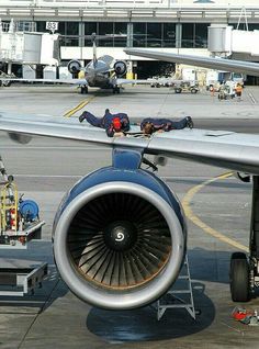 an airplane engine on the tarmac at an airport