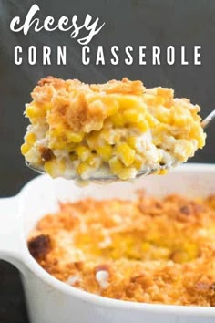 a spoon full of cheesy corn casserole on top of a white dish