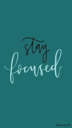 the words stay focused written in black ink on a teal green background with white lettering