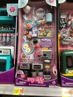 two toy kitchen appliances are on display for sale in a toys r'us store