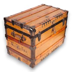 an old wooden trunk sitting on top of a white floor