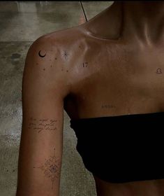 a woman with a tattoo on her left arm and the word love is written in cursive writing