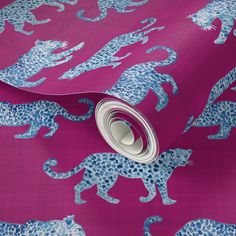 a pink and blue wallpaper with leopards on it