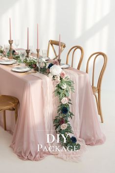 the table is set with flowers and candles