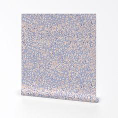 an abstract blue and pink painting with dots on it's surface, against a white background