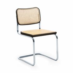 a white chair with a black seat and back rest on a metal frame, against a white background