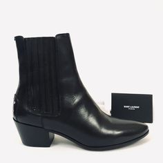 Saint Laurent Paris West 45 Chelsea Black Leather Ankle Boots Msrp $995.00 Size: Eu 36 Us 6 Uk 3 Color: Black Chelsea Boots Almond Toe Hidden Elastic Band On Both Sides Studs Details On Back Texano Heel Leather Insole With Logo Leather Sole With Rubber Heel Pad Comes With Dust Bag Made In Italy Brand New With Box 100% Guaranteed Authentic Designer Chelsea Boots With Pointed Toe And Leather Sole, Designer Chelsea Ankle Boots For Work, Luxury Ankle-high Chelsea Boots For Fall, Luxury Pointed Toe Chelsea Boots For Fall, Designer Chelsea Boots For Business Occasions In Fall, Designer Chelsea Boots For Business In Fall, Designer Business Heeled Boots With Reinforced Heel, Designer Business Chelsea Boots For Fall, Designer Heeled Boots With Reinforced Heel For Business