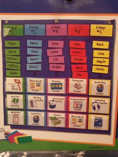 a colorful bulletin board with words and pictures on the front, along with magnets attached to it