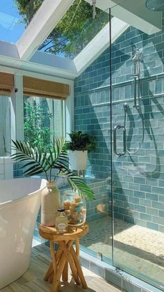 a bath room with a stand up shower and a tub