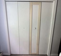 an open closet door in the corner of a room