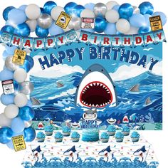 a shark themed birthday party with balloons and decorations