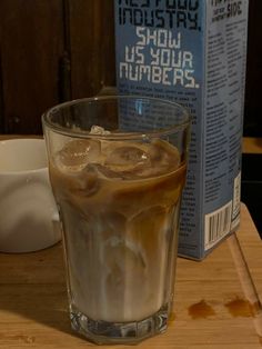 an iced drink sitting on top of a wooden table