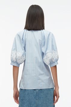 Striped poplin is interjected with lace detailing for a unexpected juxtaposition on this collared shirt. Pleated construction creates a sophisticated lantern sleeve that heightens the masculine and feminine play. Pair back with our denim paneled wrap skirt. 100% Cotton Short sleeve Long length Professional dry clean on Spring Cotton Tops With Contrast Lace, Sailor Shoes, Lace Oxfords, Knit Swimwear, Shirt With Lace, Oxford Blue, Stripe Shirt, Closet Designs, Collared Shirt