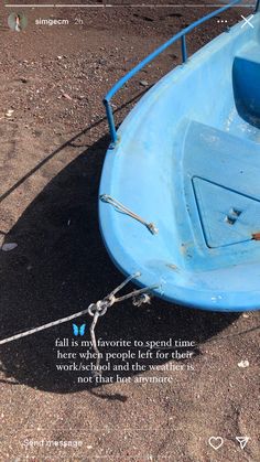 a blue boat tied up to the beach with a quote on it that reads, fall is my favorite to spend time here when people left for their work