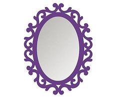 a purple oval mirror sitting on top of a white wall