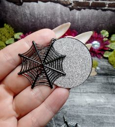 "These earrings feature lightweight charms. Laser cut spiderwebs have been placed over silver glitter disks to highlight their design and beauty. They have silver plated ear wires. Earrings are 2 1/2\" Long and 1 1/2\" wide *Color may vary slightly due to camera flash or individual computer monitors Store policies: https://www.etsy.com/shop/eternalnightboutique#policies Back to the shop: https://www.etsy.com/shop/eternalnightboutique" Silver Witchy Earrings For Party, Silver Witchy Party Earrings, Witchy Silver Earrings For Halloween, Web Spider, Dagger Necklace, Spider Jewelry, Spider Necklace, Spider Halloween, Jewelry Halloween