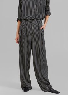 Color: Black Pinstripe Lightweight fluid fabric Relaxed fit Wide leg Double pleat detail Side seam hip pockets Hook and bar closure Zip fly Unlined 100% Polyester Dry Clean By The Frankie Shop. Imported Pinstripe Bottoms With Pockets For Formal Occasions, Pinstripe Bottoms With Welt Pockets For Work, Pinstripe Bottoms With Pockets For Work, Elegant Striped Pants With Pockets, Pinstripe Formal Bottoms With Pockets, Pinstripe Tapered Leg Business Casual Pants, Black Bottoms With Contrast Stripes For Work, Black Bottoms With Contrast Stripes For Workwear, Pinstripe Wide Leg Pants With Pockets