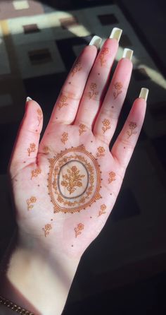 a woman's hand with hendix painted on it