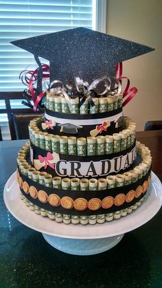 a graduation cake made out of stacks of money