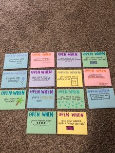 several pieces of paper with words written on them sitting on the floor next to each other