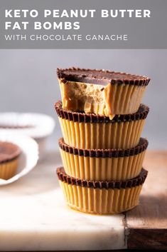 three chocolate cupcakes stacked on top of each other with peanut butter in the middle