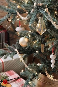 a decorated christmas tree with presents under it