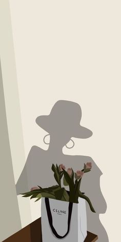 a white bag with flowers in it sitting on a table next to a shadow of a woman