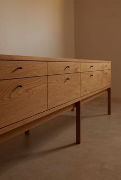 a large wooden dresser sitting on top of a floor