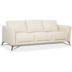 a white leather couch sitting on top of a wooden frame